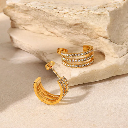 Zircon C-hoop earrings flat lay