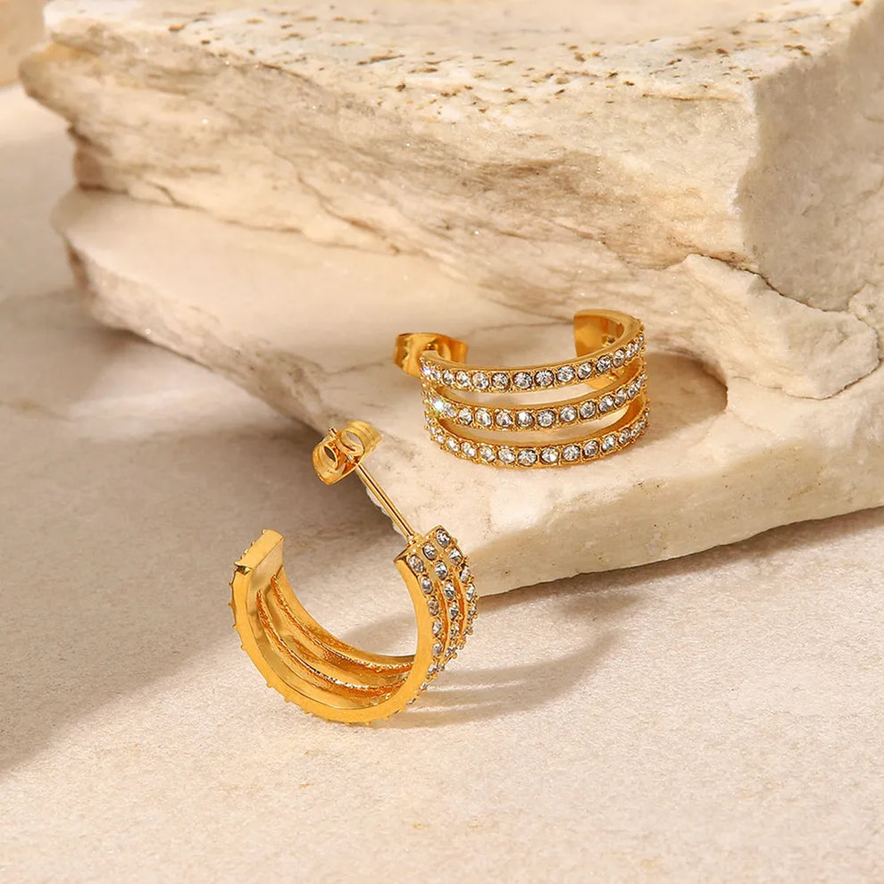 Zircon C-hoop earrings flat lay