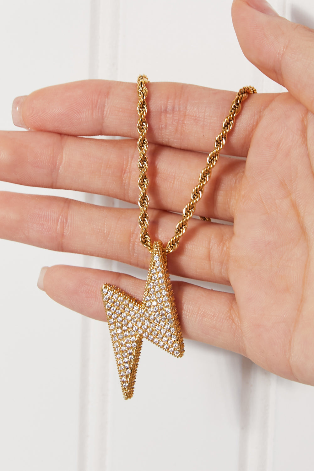 Lightning bolt pendant close-up with CZ accent