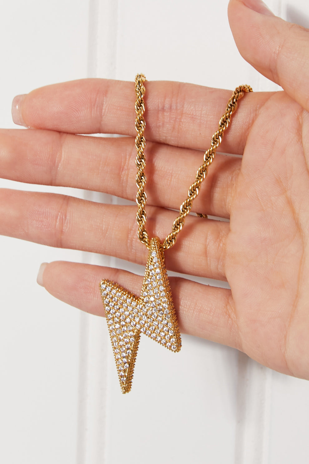 Lightning bolt pendant close-up with CZ accent
