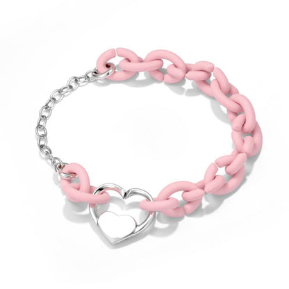 Heart link bracelet detail with pink chain accent
