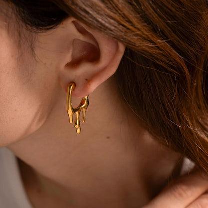 Molten drip studs worn on model
