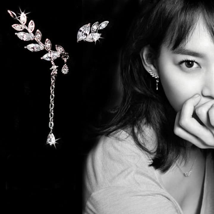 Leaf climber cuff worn on model showing asymmetric design