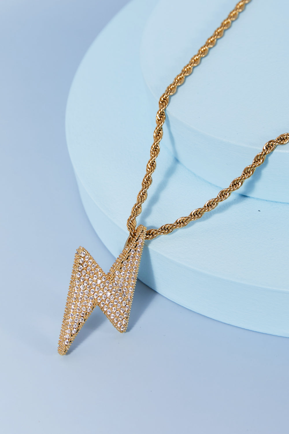 Brass lightning necklace worn on model