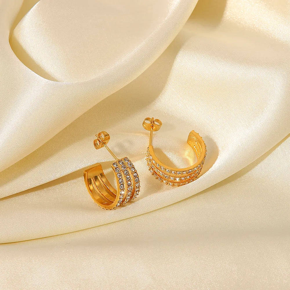 Zircon C-hoop earrings close-up detail