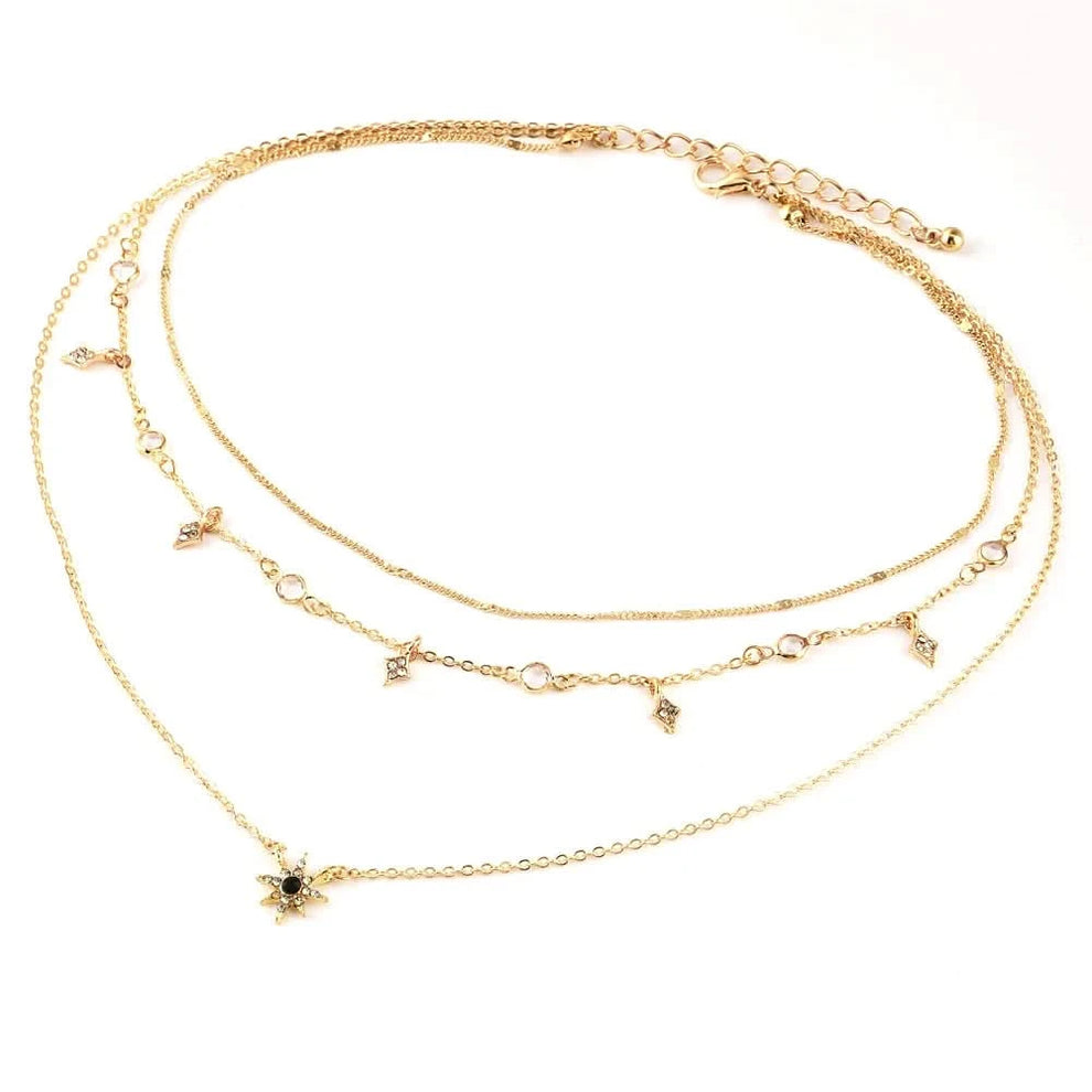 Layered star necklace styled with outfit
