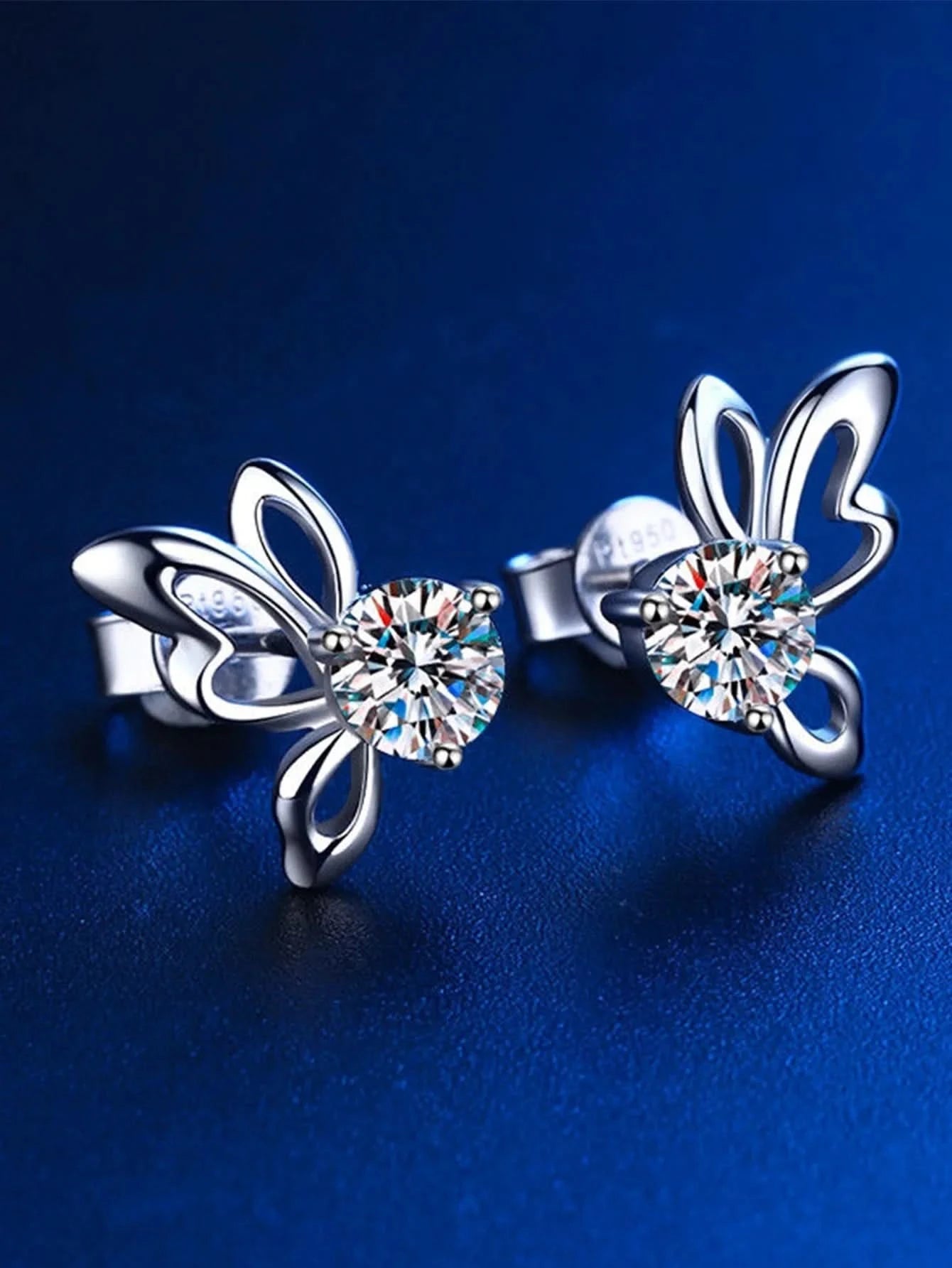 Butterfly studs flat lay on white
