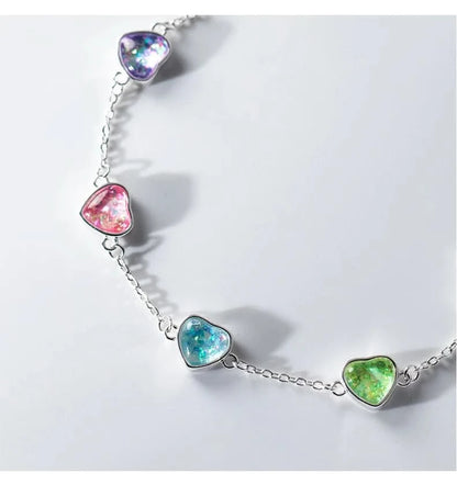 Rainbow heart charm bracelet flat lay