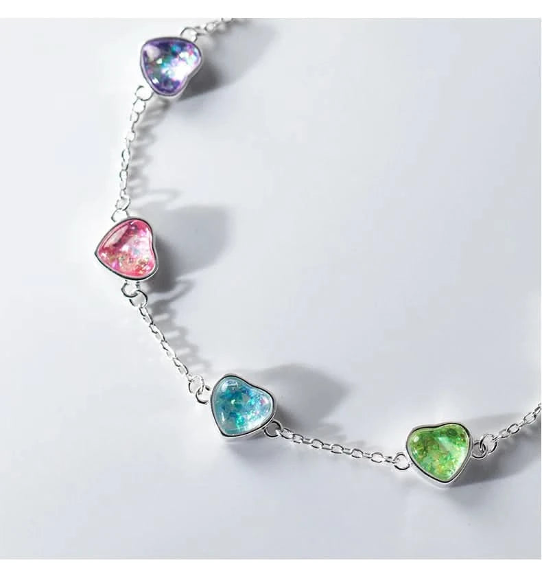 Rainbow heart charm bracelet flat lay