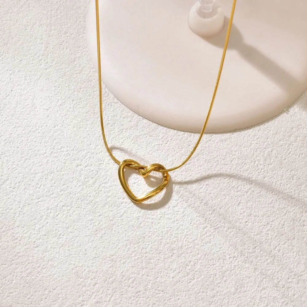 Hollow heart pendant necklace in titanium steel — main view