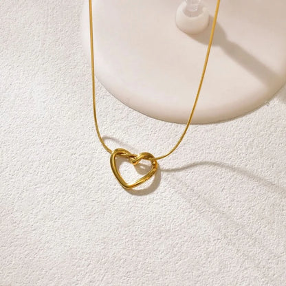 Hollow heart pendant necklace in titanium steel — main view
