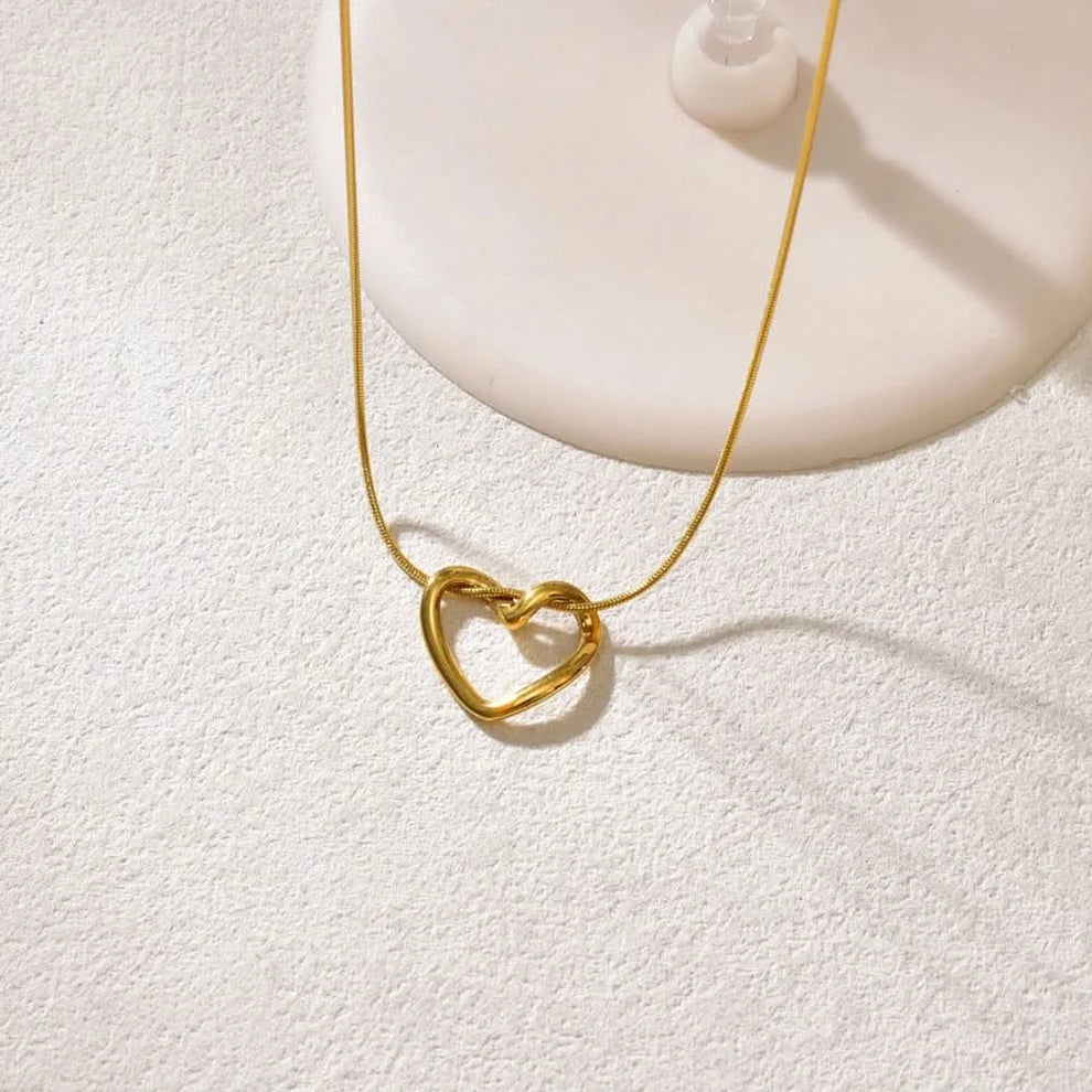 Hollow heart pendant necklace in titanium steel — main view