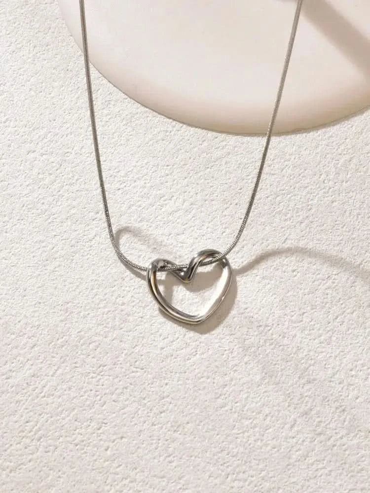 Hollow heart pendant necklace side angle view