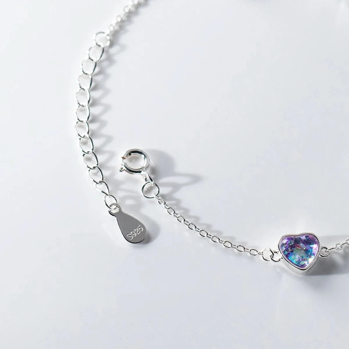 Heart charm bracelet worn on wrist