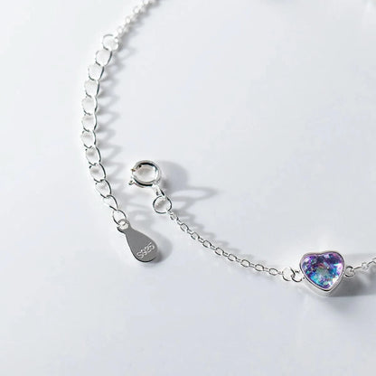 Heart charm bracelet worn on wrist