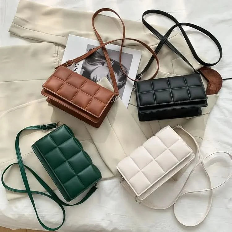Square handbag worn as top-handle bag