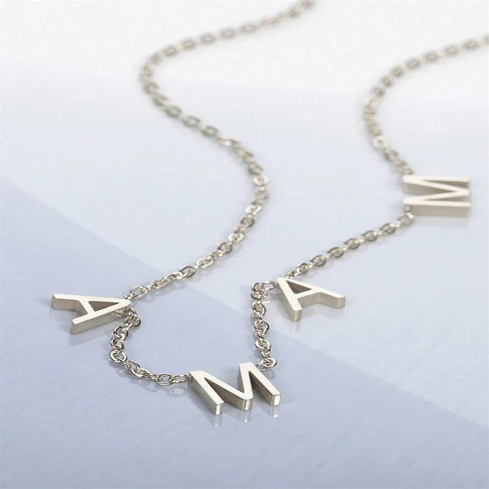 Custom MAMA name necklace worn on model
