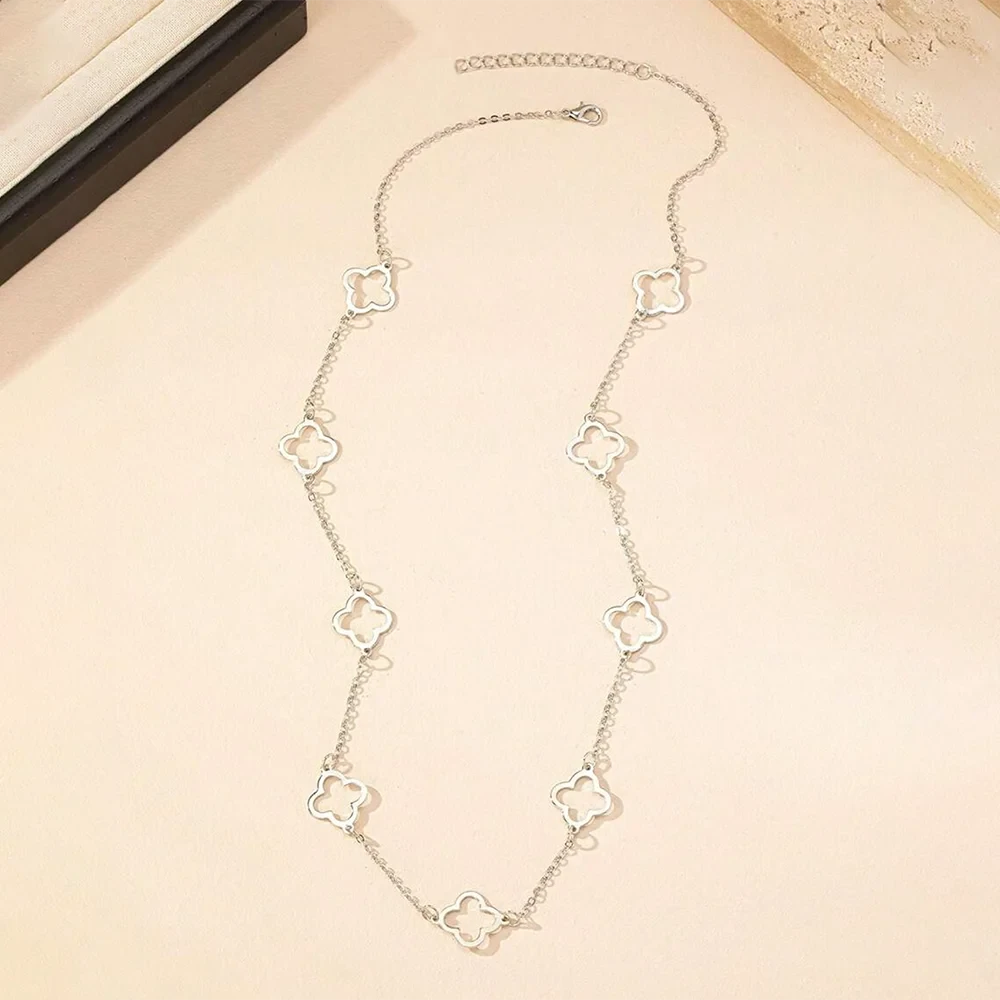 Clover necklace layered with other pieces