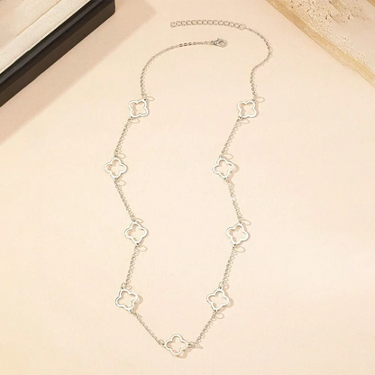 Clover necklace layered with other pieces