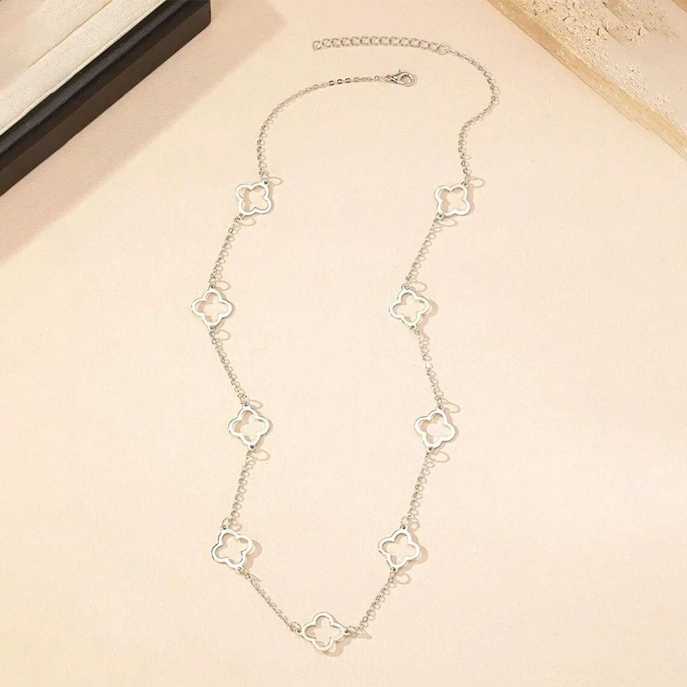 Clover necklace layered with other pieces