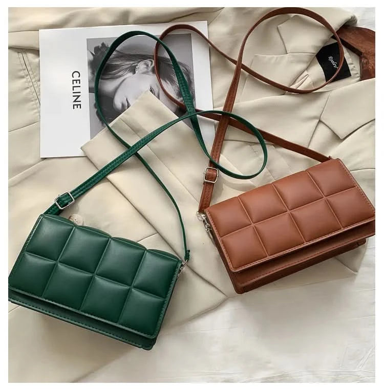 Square handbag carried as clutch