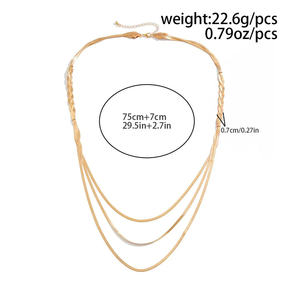 Braided gold necklace worn on model