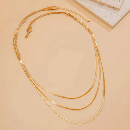Multi-layered braided gold necklace full overview