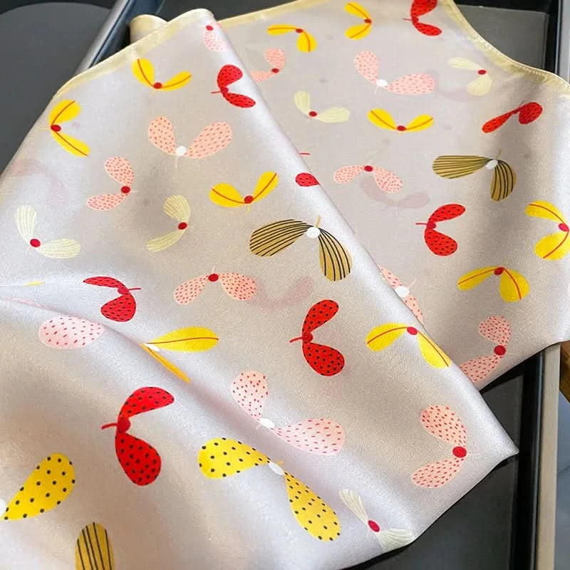 Silk scarf draped on lapel