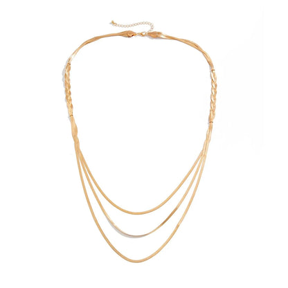Multi-layer gold chain styled with outfit