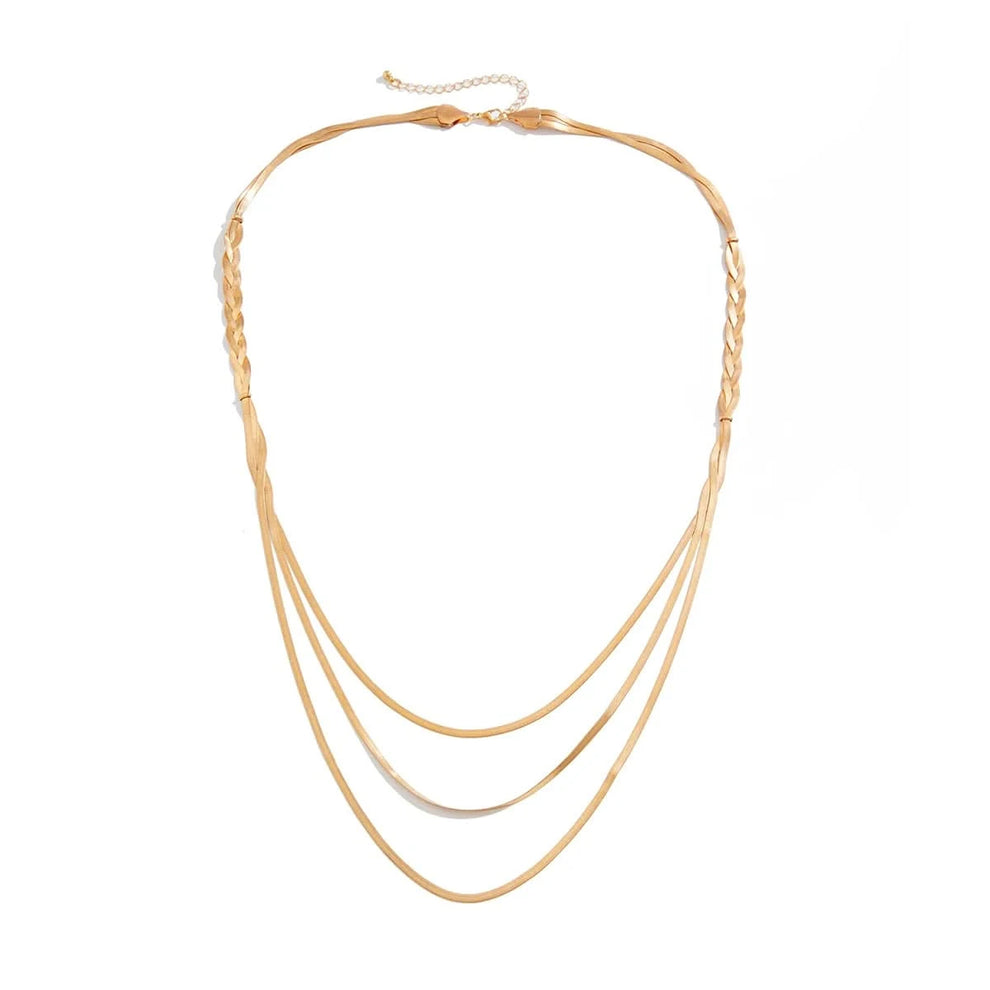 Multi-layer gold chain styled with outfit