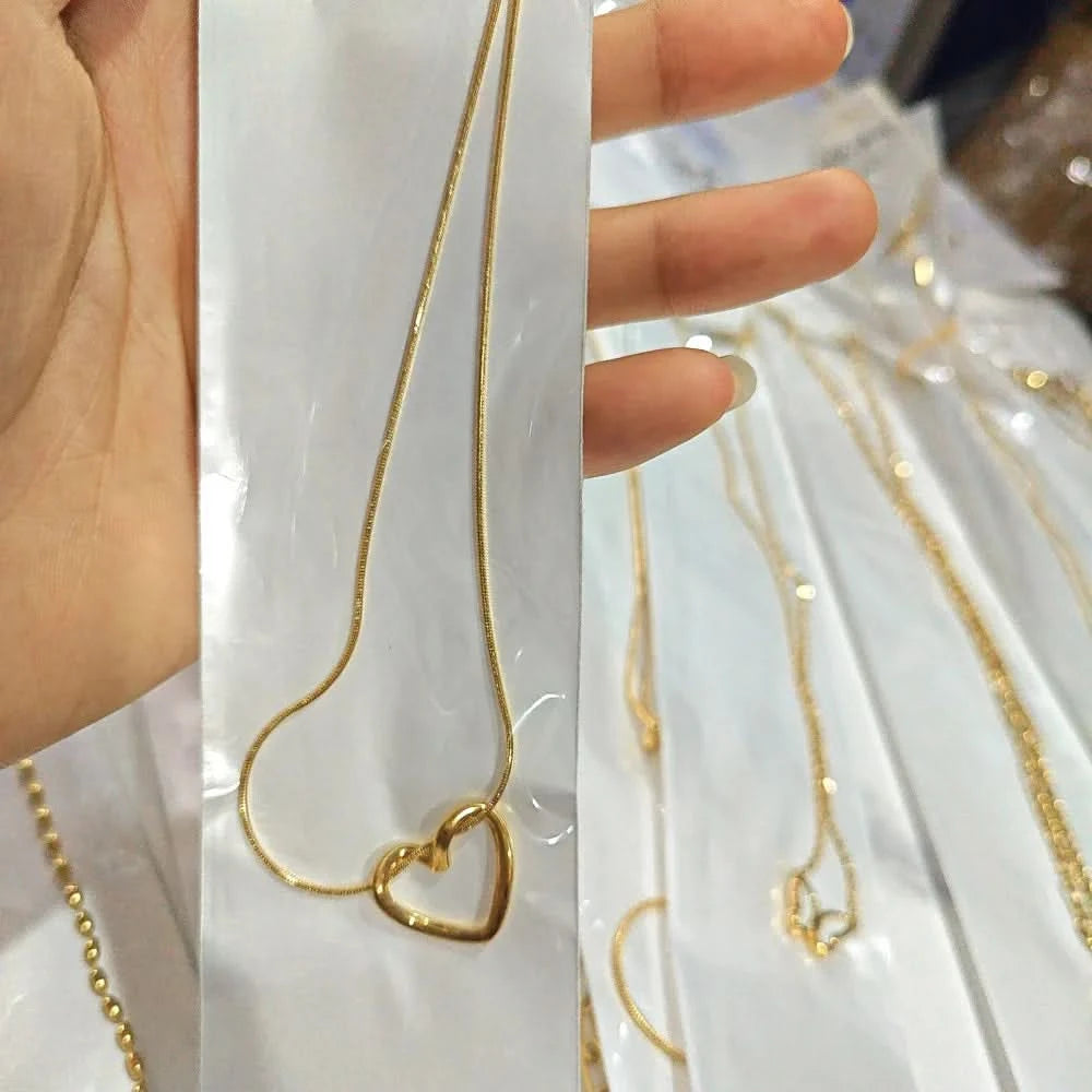 Hollow heart pendant necklace styled with outfit