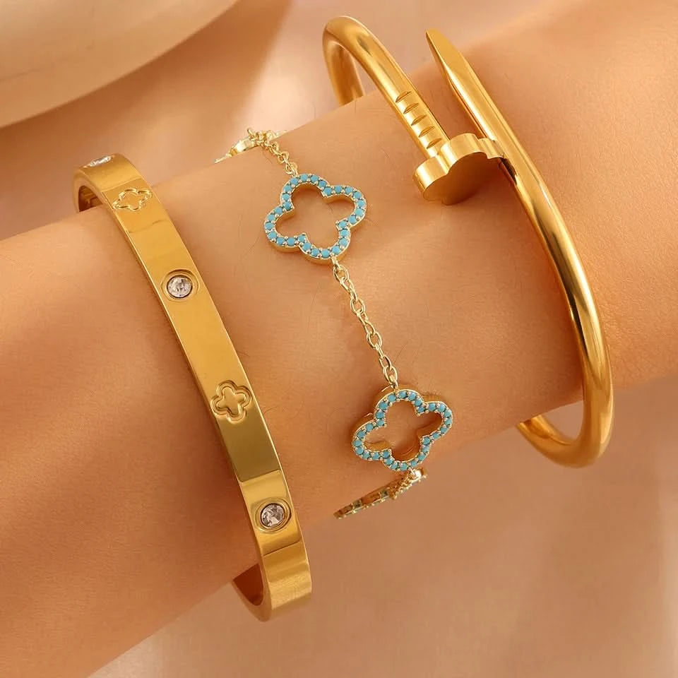 Nail bangle stacked with other bracelets