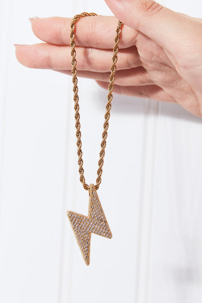 Lightning pendant on twisted brass chain detail
