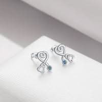 Stethoscope earring close-up showing crystal accent